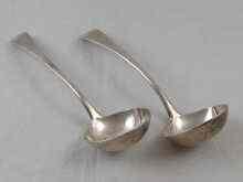 Appraisal: A pair of Georgian silver sauce ladles by Peter and