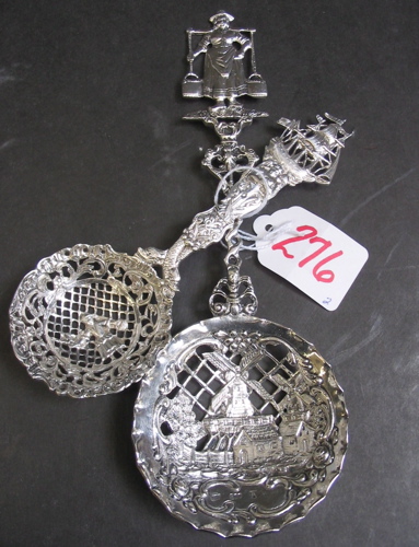 Appraisal: TWO CONTINENTAL SILVER ORNAMENTAL SPOONS reticulated bowls Dutch girl and