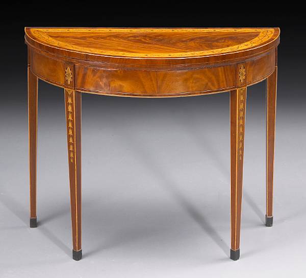 Appraisal: A George III crossbanded and penwork decorated mahogany games table