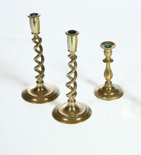 Appraisal: THREE BRASS CANDLESTICKS American or English th century Pair of