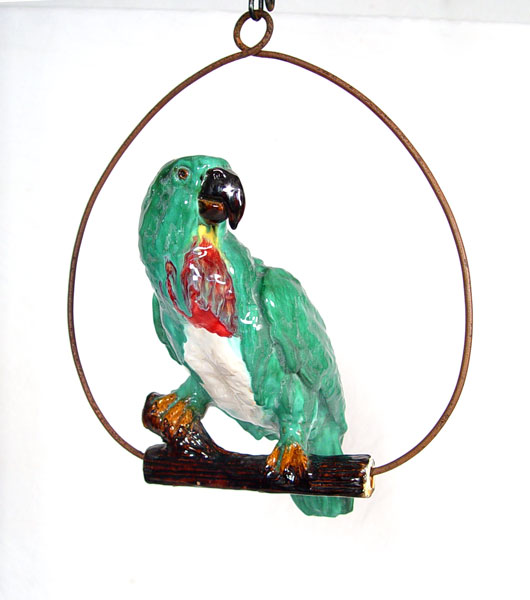 Appraisal: MAJOLICA GLAZE EARTHENWARE PARROT ON METAL SWING Parrot measures ''