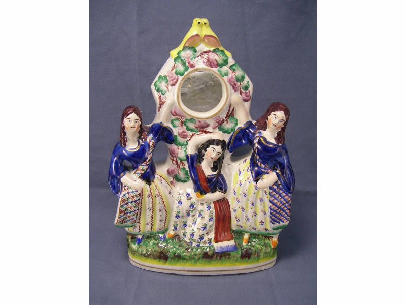 Appraisal: Staffordshire Figural Watch Holder Stoneware figural watch holder depicts three