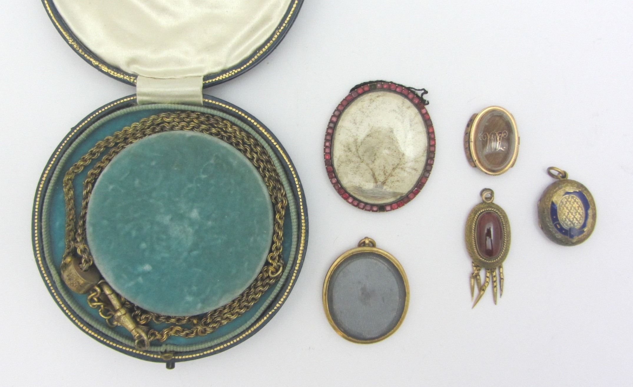 Appraisal: An oval clasp glazed to the centre and mounted with