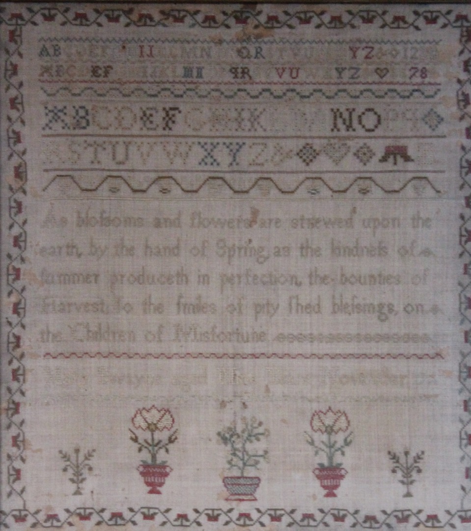 Appraisal: A George III pictorial motto and alphabetic sampler by Mary