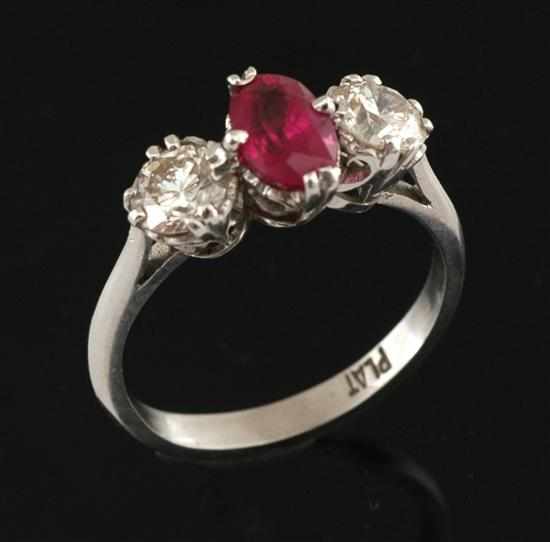 Appraisal: A ruby and diamond ring Centrally set with an oval