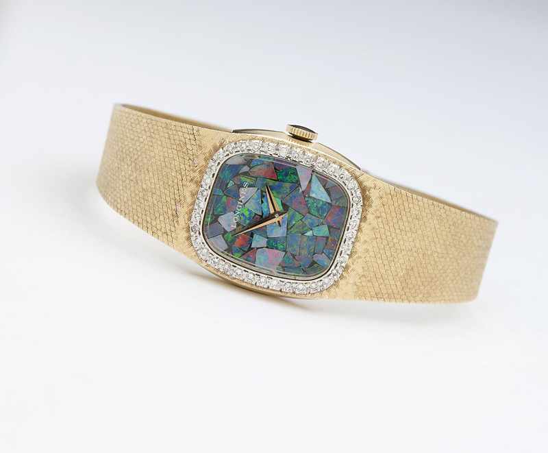 Appraisal: The rectangular mosaic opal dial signed Longines attached to a