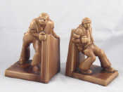 Appraisal: A pair of German s ceramic bookends representing toiling workers