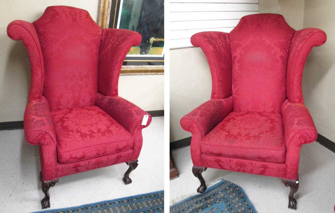 Appraisal: A PAIR OF CHIPPENDALE STYLE WING-BACK ARMCHAIRS Hancock Morre Fine