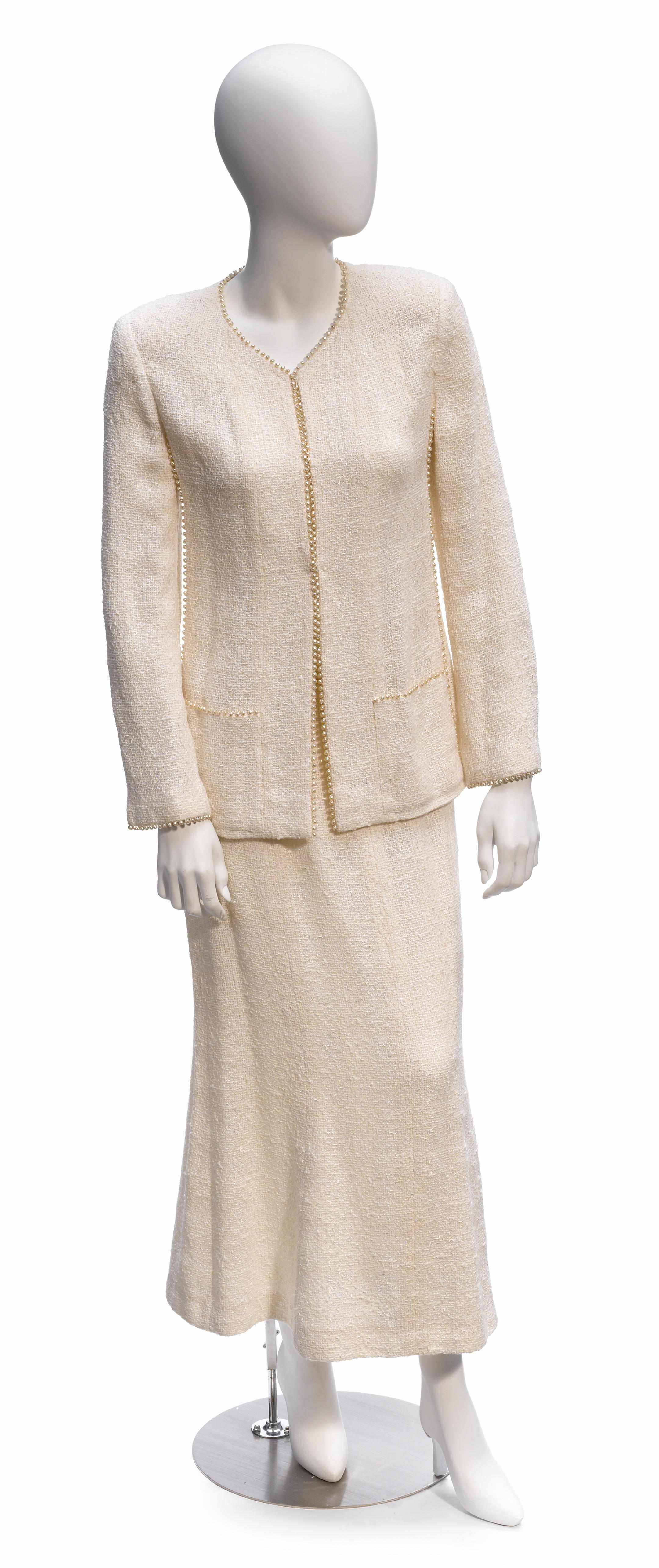 Appraisal: A Chanel boucl cream pearl beaded jacket and skirt suit