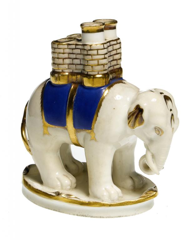 Appraisal: A ROCKINGHAM ELEPHANT QUILL HOLDER with blue and gilt saddle