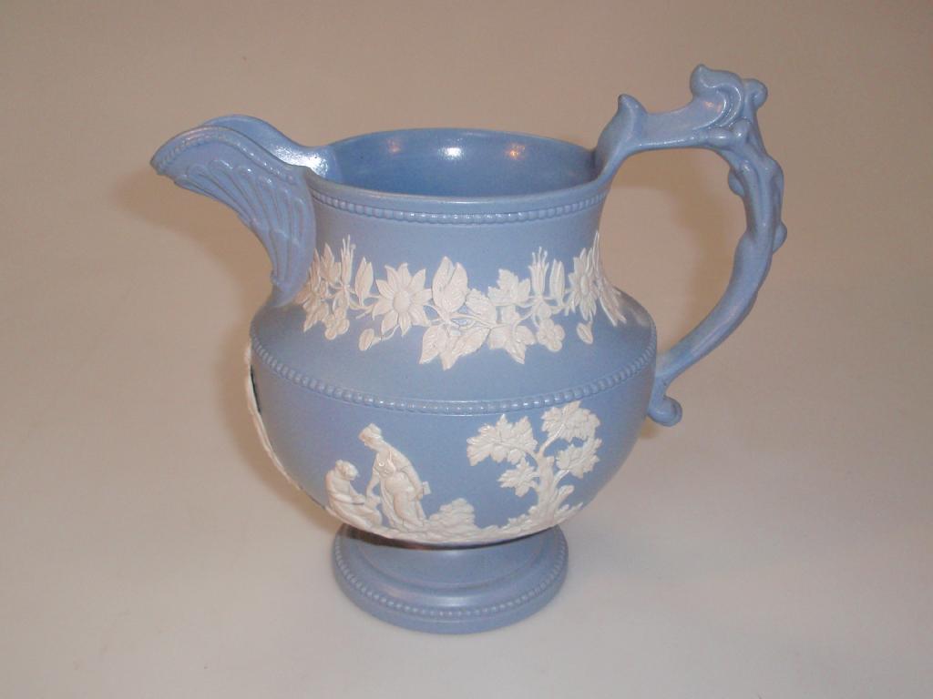 Appraisal: A thC Jasperware jug silver shape with matt blue ground