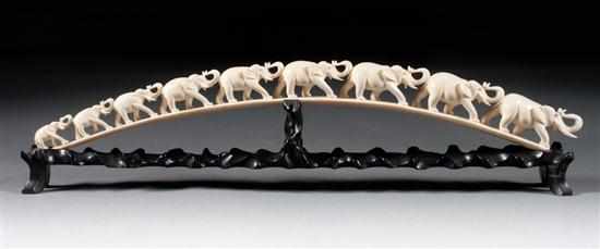 Appraisal: African carved ivory elephant bridge on ebonized wood stand bridge