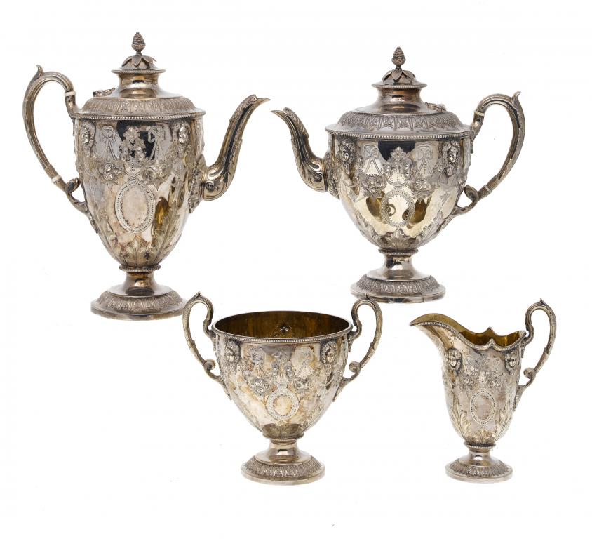 Appraisal: A VICTORIAN TEA AND COFFEE SERVICE of vasular form applied