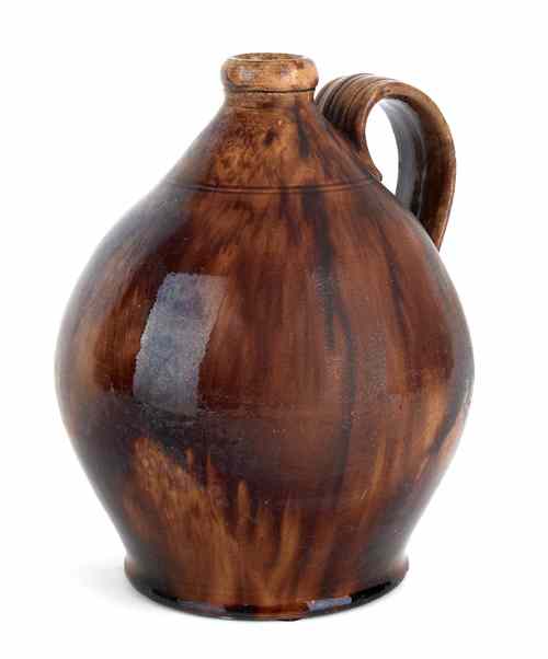 Appraisal: Maine redware jug th c with cream and brown glazing