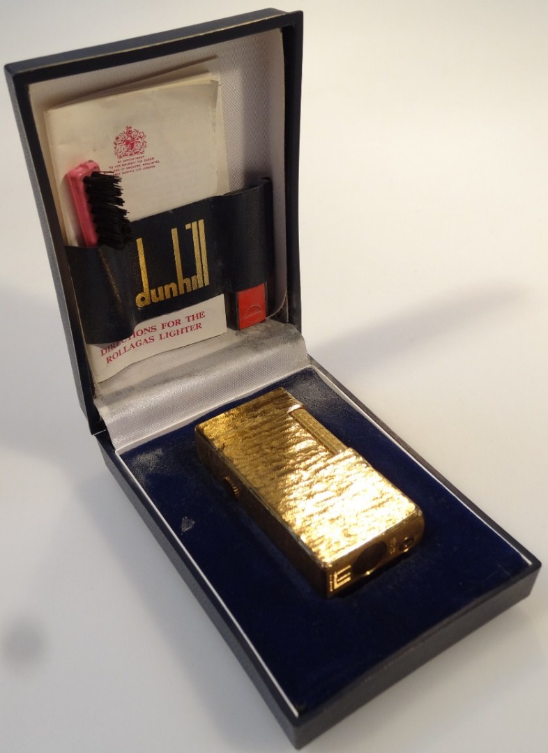 Appraisal: A mid- thC Dunhill pocket lighter cm high in textured