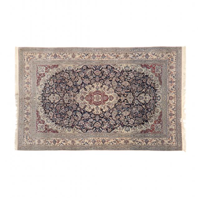 Appraisal: PERSIAN RUG Wool with silk highlights dark blue field with