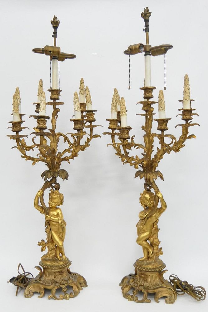 Appraisal: Pr th C DORE BRONZE FIGURAL CHERUB CANDELABRA A pair