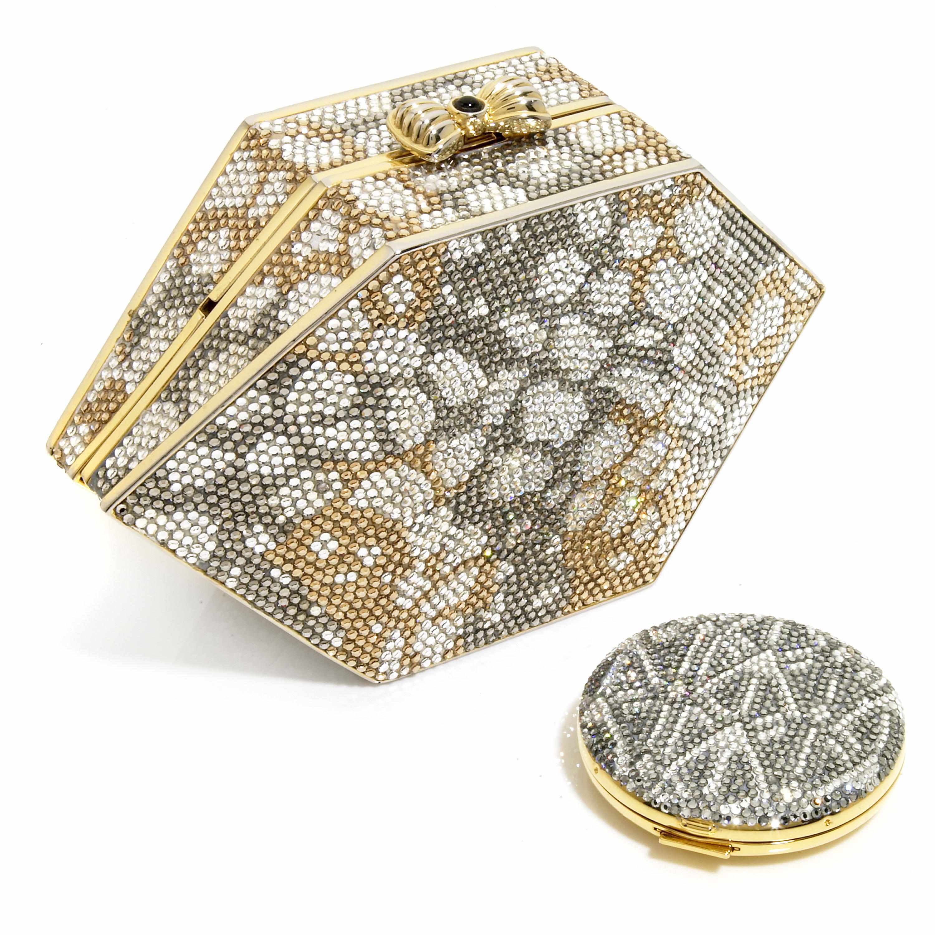 Appraisal: A silver and gold crystal patterned purse with a bow