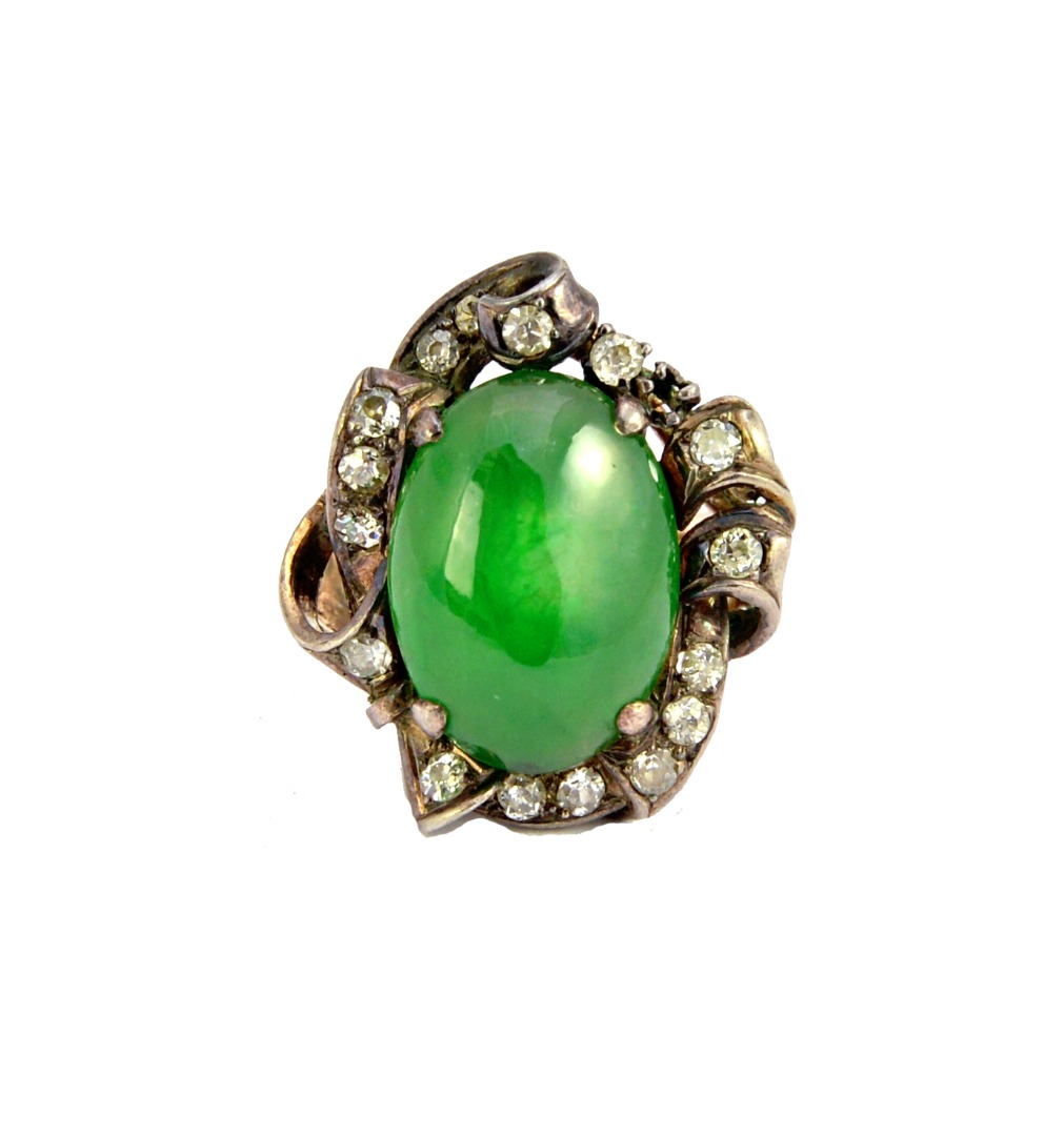 Appraisal: A gold jade and diamond set ring mounted with the