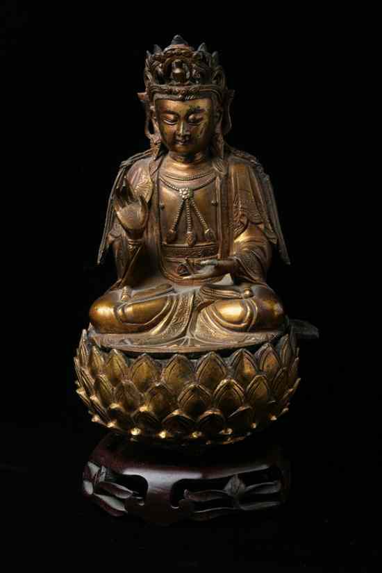 Appraisal: CHINESE GILT BRONZE FIGURE OF GUANYIN Ming Dynasty The bodhisattva