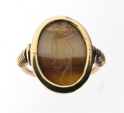 Appraisal: A gold ring mounted with a carved agate intaglio Size