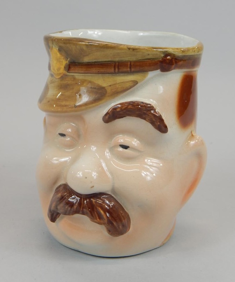 Appraisal: An early thC character jug modelled in the form of