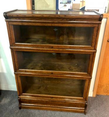 Appraisal: A Globe Wernicke oak bookcase with three glass fronted sections