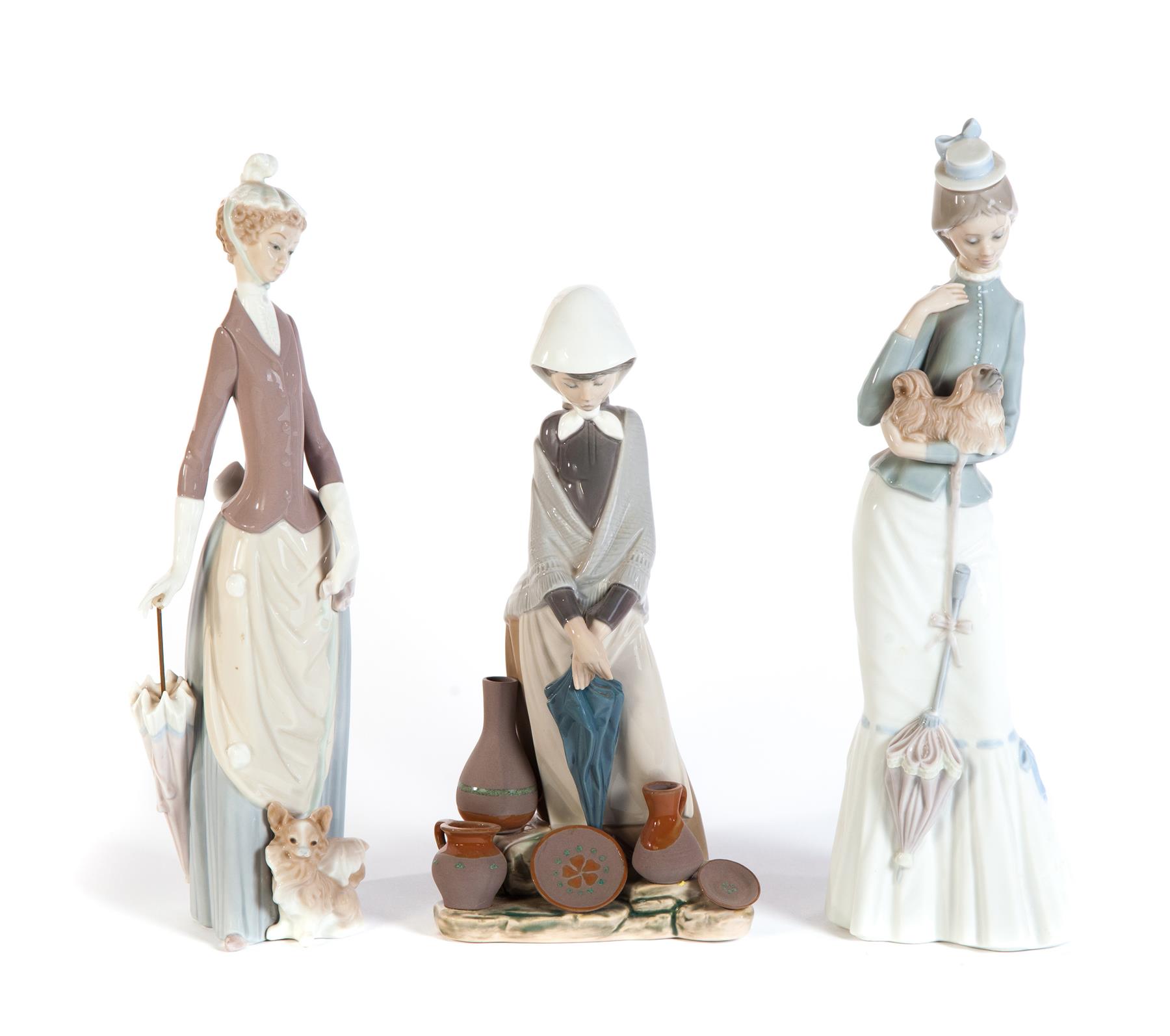 Appraisal: THREE LLADRO FIGURES OF LADIES Spain th century High glaze