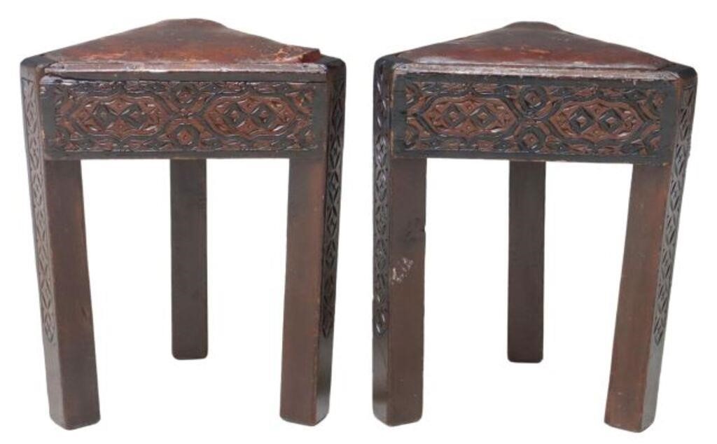 Appraisal: pair Moroccan carved wood triangular stools having seat in worn