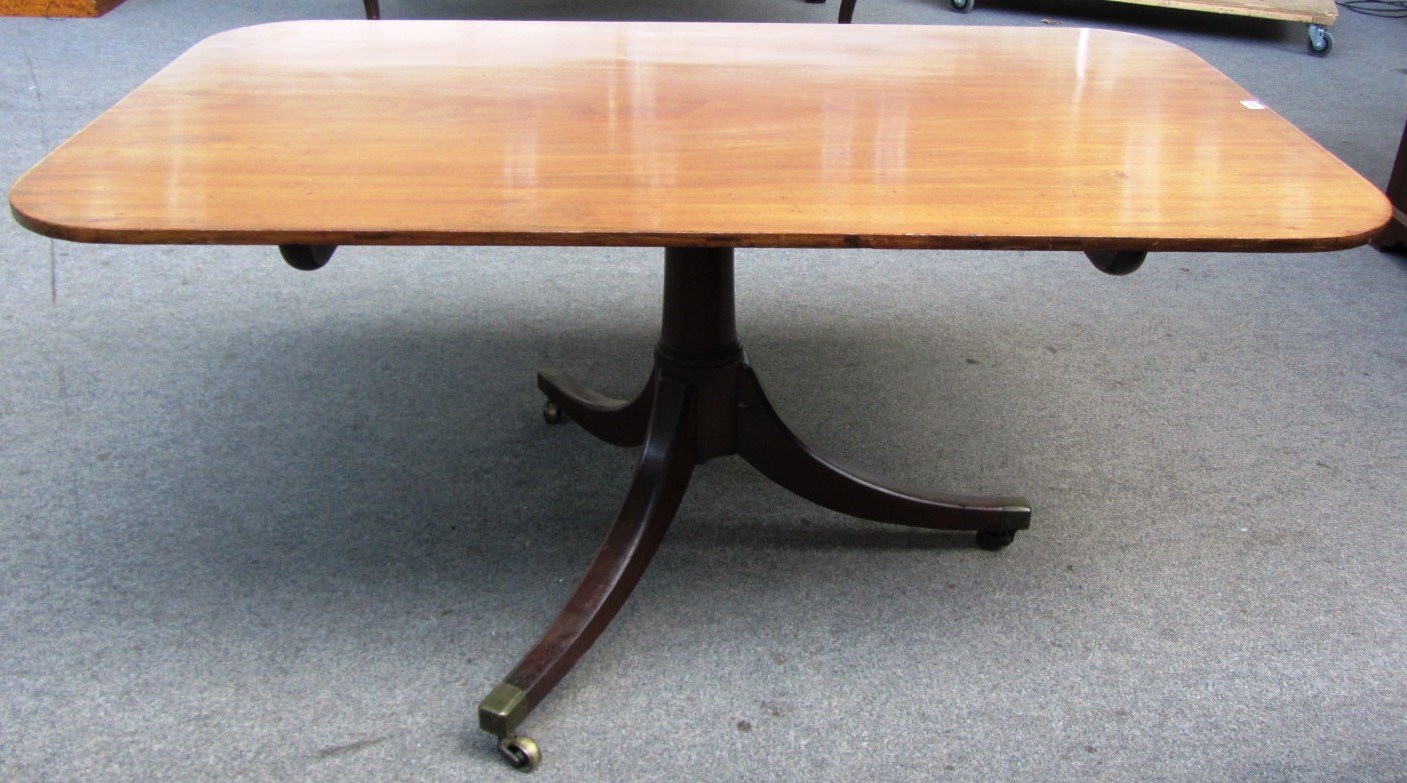 Appraisal: A George III mahogany centre dining table with snap rectangular