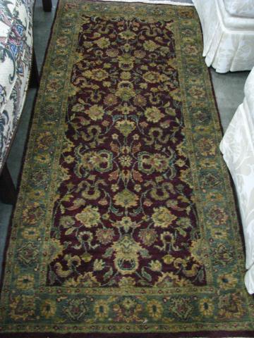 Appraisal: Two Agra Oriental Rugs in dark burgundy one is a