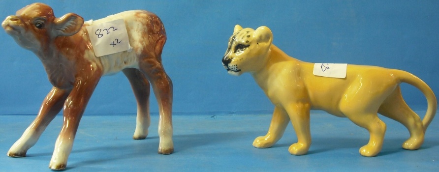 Appraisal: Beswick Hereford Calf Back Leg Restored and Lioness Facing Left