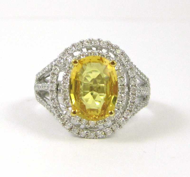 Appraisal: YELLOW SAPPHIRE DIAMOND AND FOURTEEN KARAT GOLD RING The white