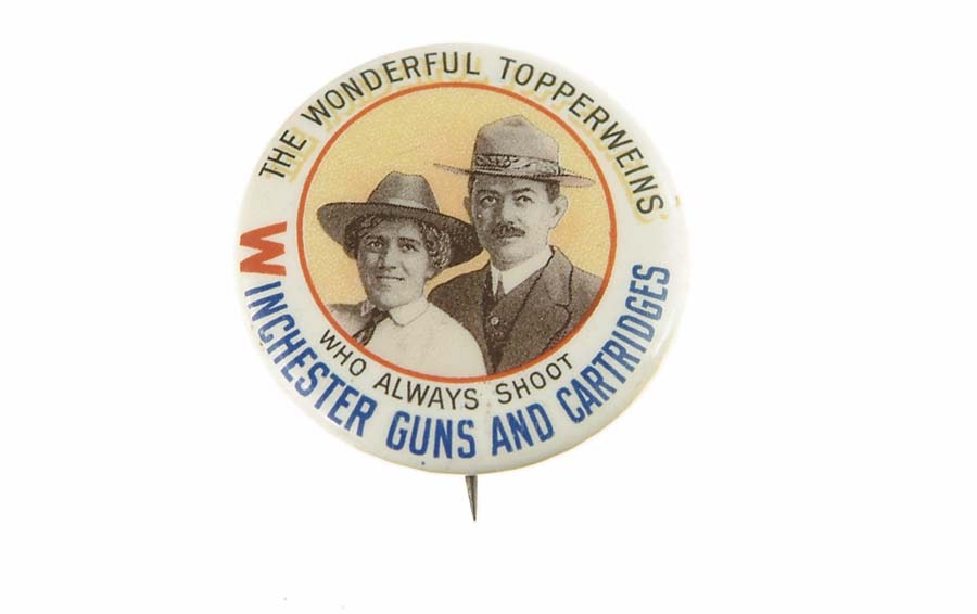 Appraisal: WINCHESTER - TOPPERWEINS ADVERTISING PIN The Topperwein's husband and wife