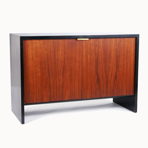 Appraisal: VLADIMIR KAGAN Walnut veneer and black laminate two-door cabinet en