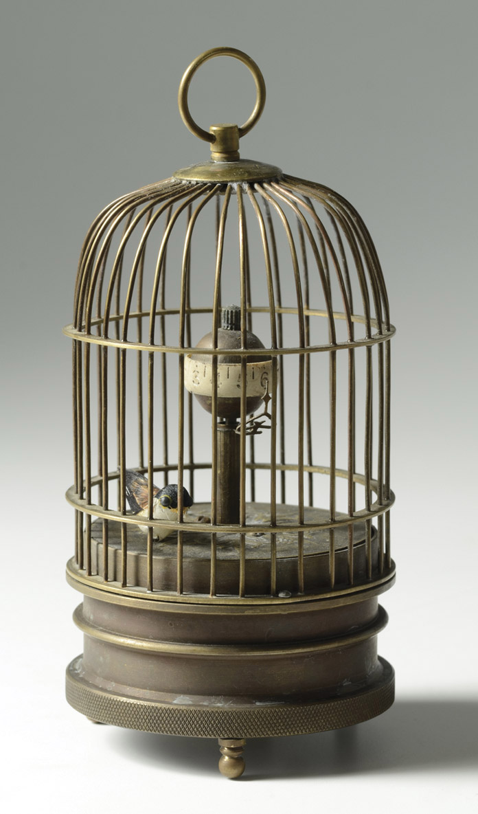 Appraisal: MECHANICAL BIRD CAGE ANNULAR CLOCK the mechanical bird moves with