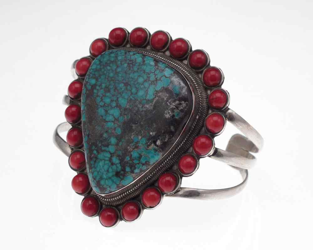 Appraisal: TURQUOISE AND CORAL STERLING SILVER BRACELET Large triangular shaped turquoise