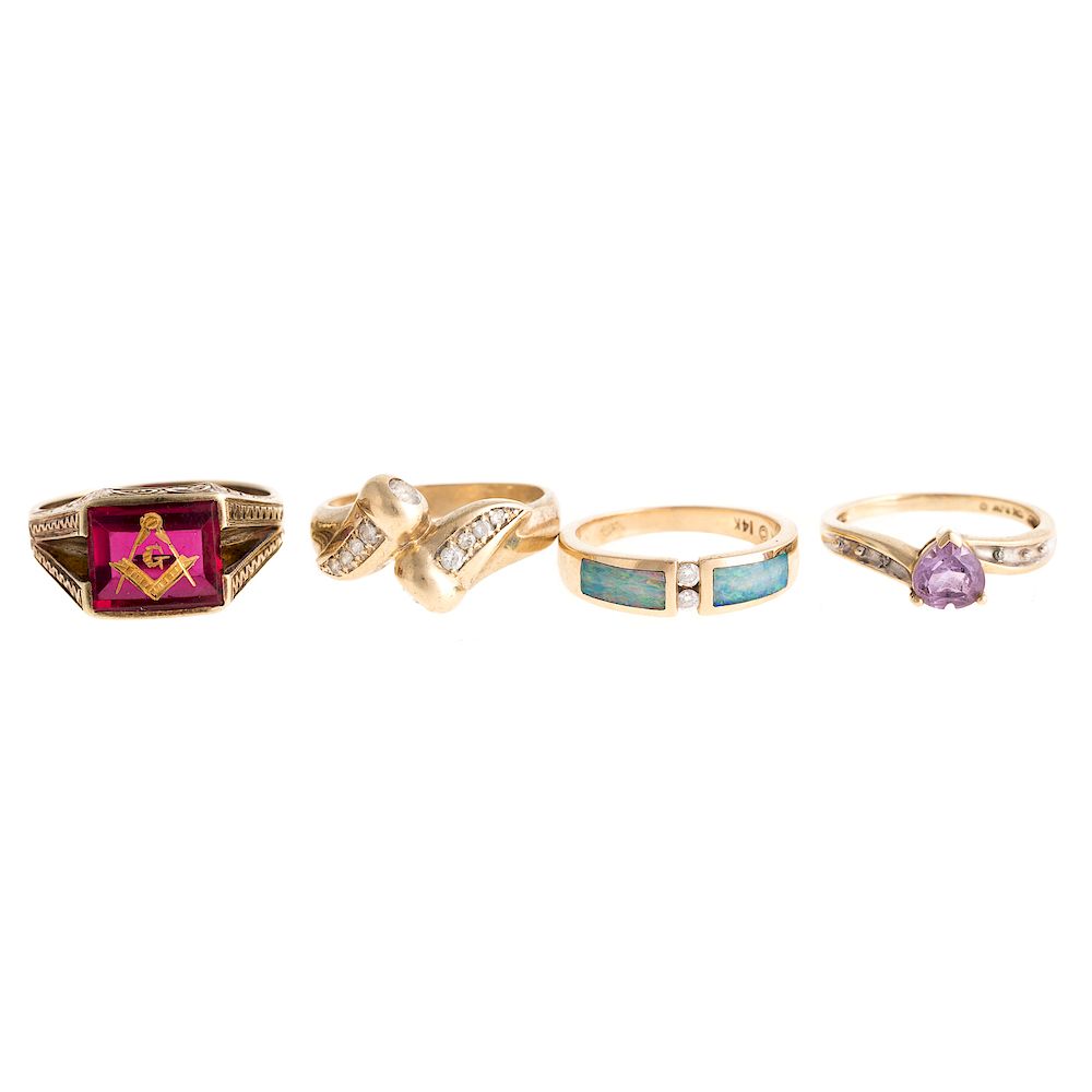 Appraisal: Four Ladies Gemstone Rings in Gold K yellow gold ring