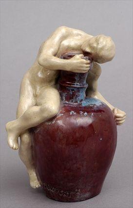 Appraisal: JAMES VIBERT STONEWARE VASE Modeled as a nude youth seated