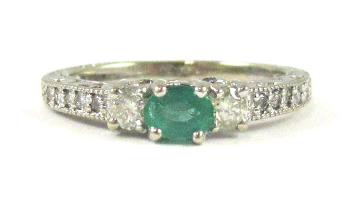 Appraisal: EMERALD DIAMOND AND FOURTEEN KARAT GOLD RING The white gold