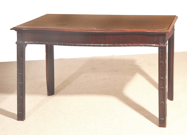 Appraisal: A CHIPPENDALE STYLE MAHOGANY SERPENTINE FRONTED SERVING TABLE with carved