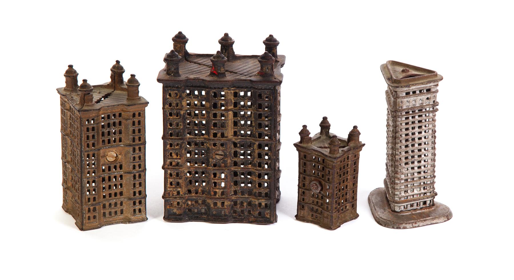 Appraisal: FOUR SKYSCRAPER BANKS American ca Cast iron with worn silver