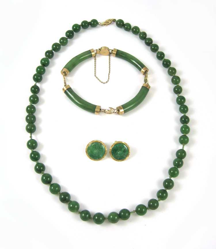 Appraisal: FOUR ARTICLES OF GREEN HARDSTONE JEWELRY including a Chinese k