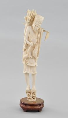 Appraisal: A Ivory Carving of a Standing Harvester Carved in bright