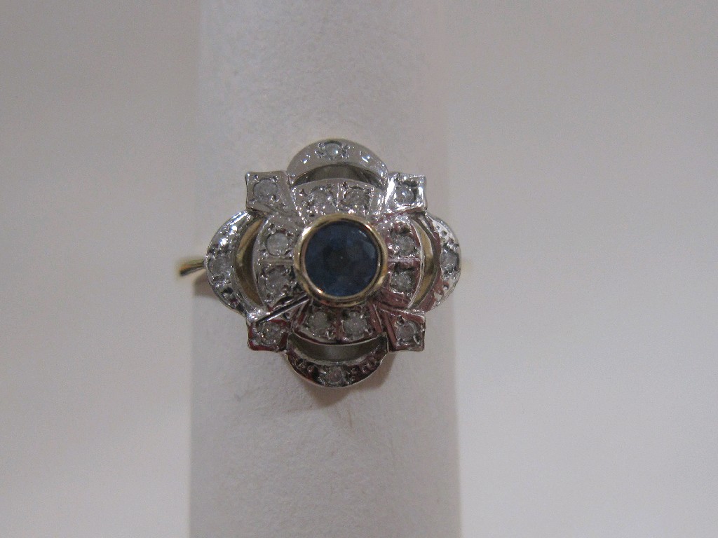 Appraisal: Nine carat gold sapphire and diamond cluster ring