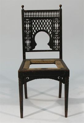 Appraisal: A Liberty Co ebonised wood Moorish chair set with musharabeyeh