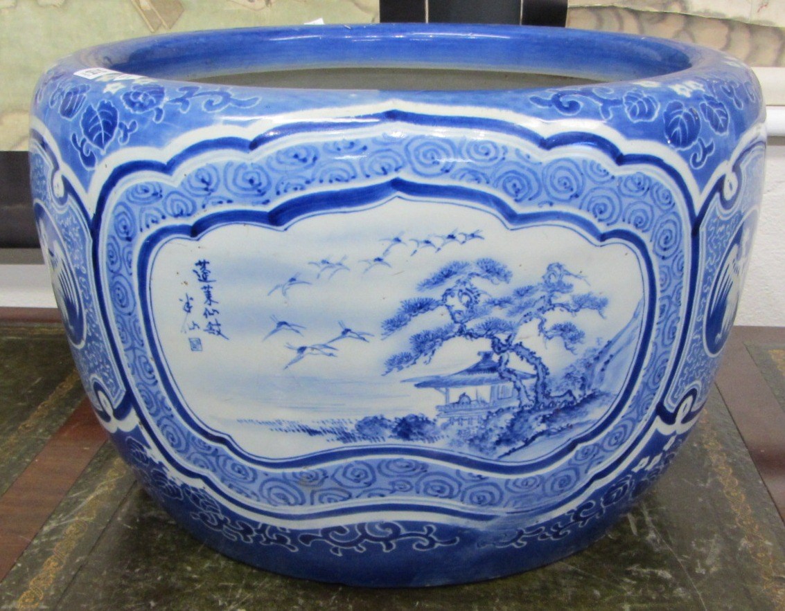 Appraisal: A large Japanese blue and white jardiniere th century painted