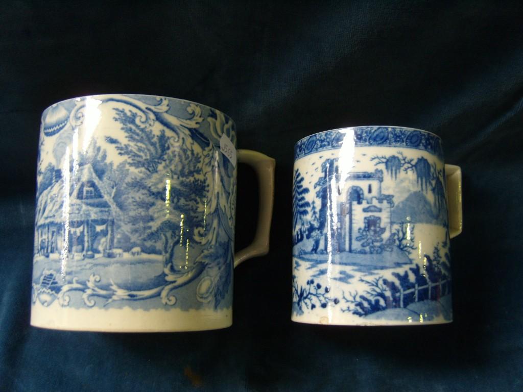 Appraisal: Two th century blue and white printed tankards one showing