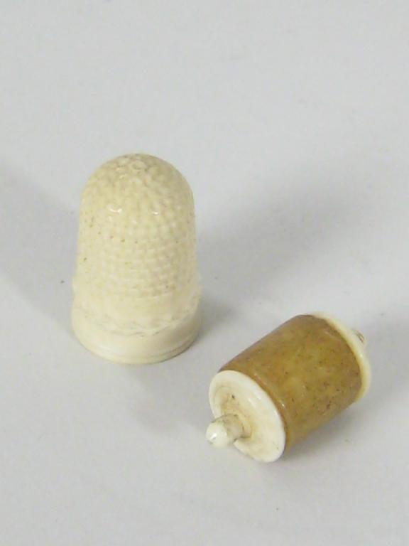 Appraisal: A small ivory Waxer and a carved ivory Thimble