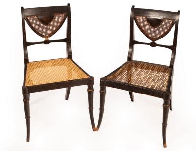 Appraisal: A pair of Regency ebonised single chairs with cane seats